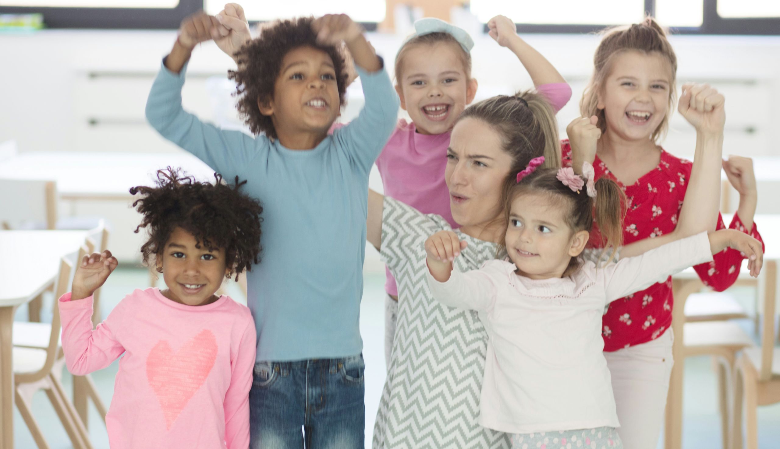 Children happy and doing victory poses.