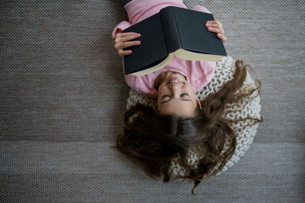 Child reading image by Getty Images for Unsplash+