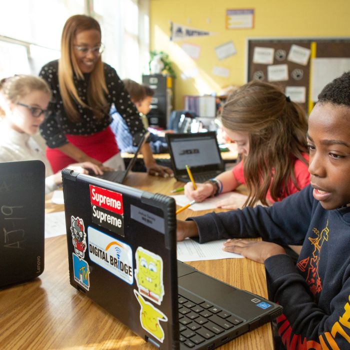 Students at Sutton Middle School use online research to answer questions during a lesson in history class.