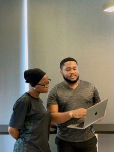 Two adults looking at a computer Two adults looking at a computer