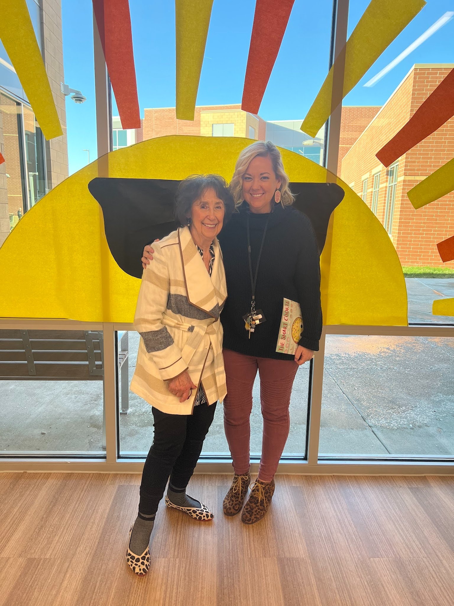 Author and her grandma standing in front of a sunshine with sunglasses
