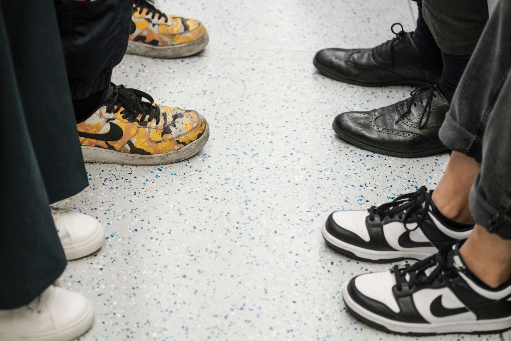 4 pair of shoes facing each other