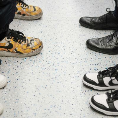 4 pair of shoes facing each other