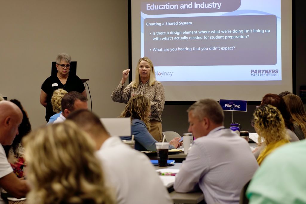 Two CIESC staff members presenting to a group of educators