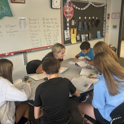 Teacher working with students
