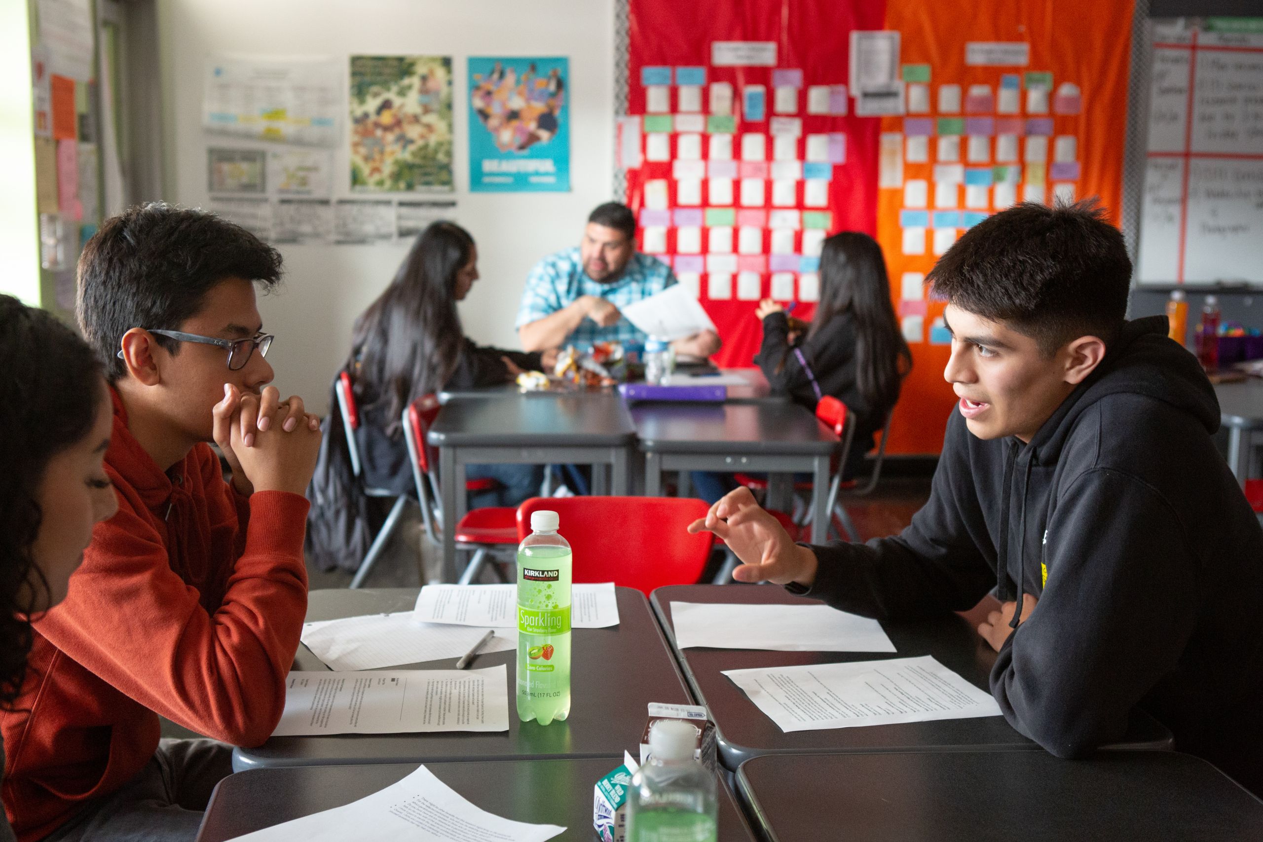 High school boy talking A high school boy explains his research topic to his classmates in an AP research class.