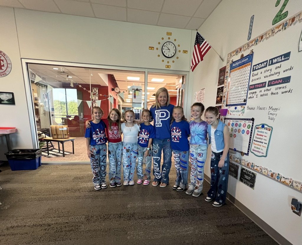 Teacher standing with 7 students